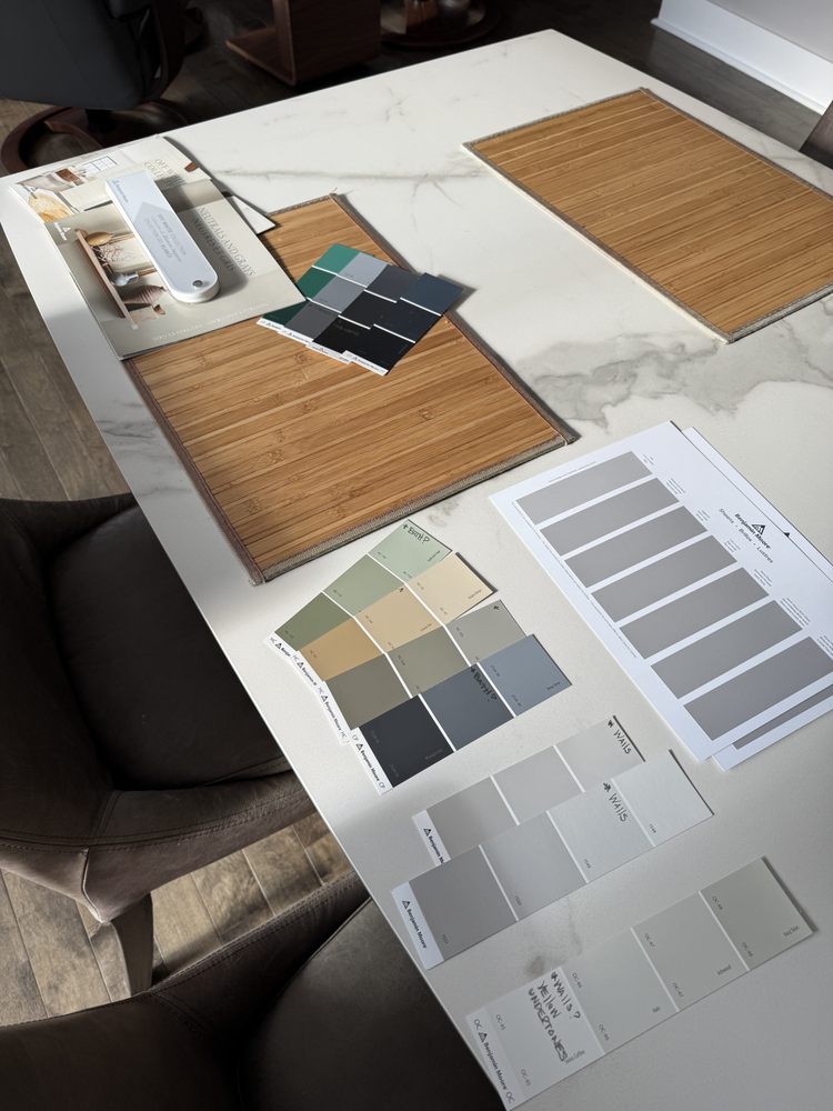 Benjamin Moore colour cards laid out on a client's table