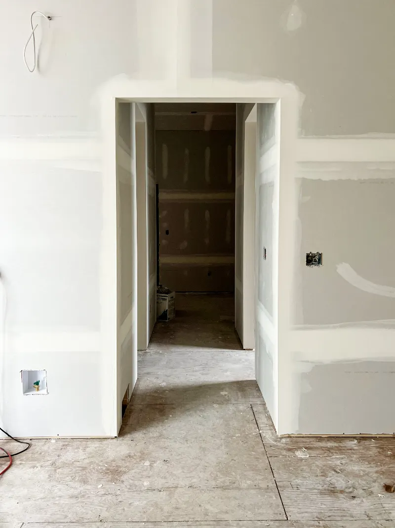 Framed doorway with mudded drywall corners
