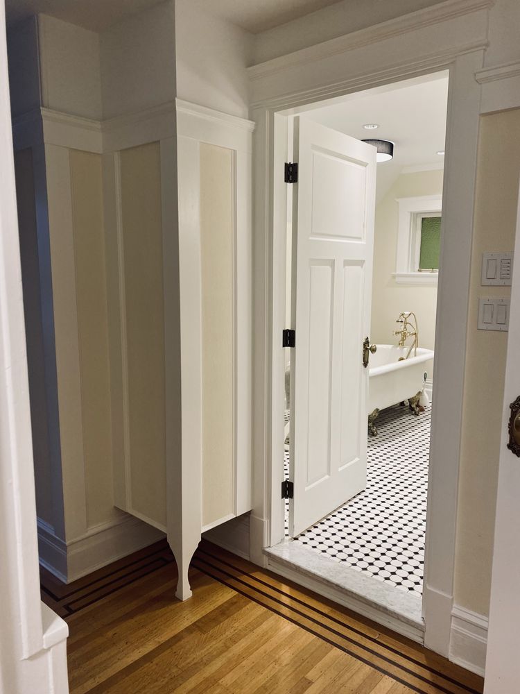 Heritage hallway with crisp white panelling and trim